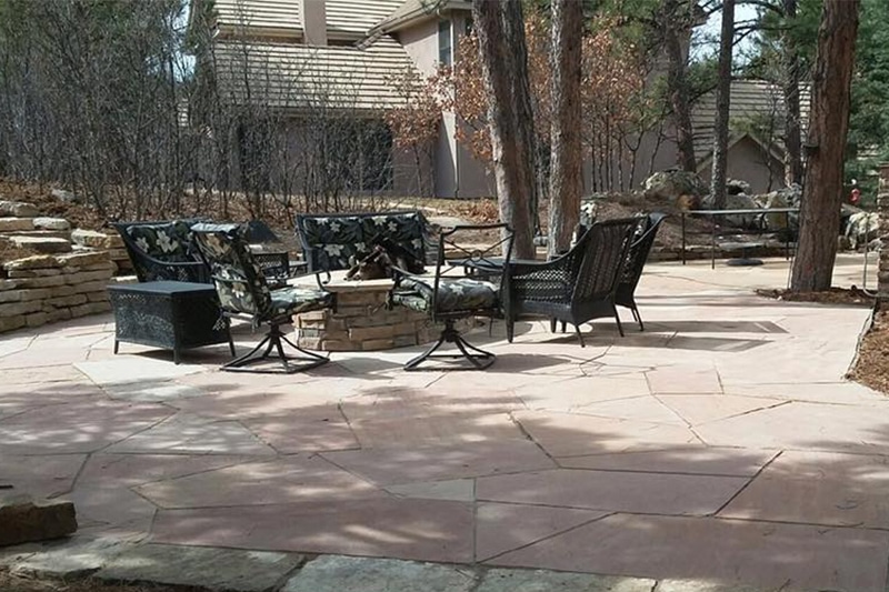 flagstone patio with seating around fire pit