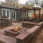 Flagstone patio with rock fire pit